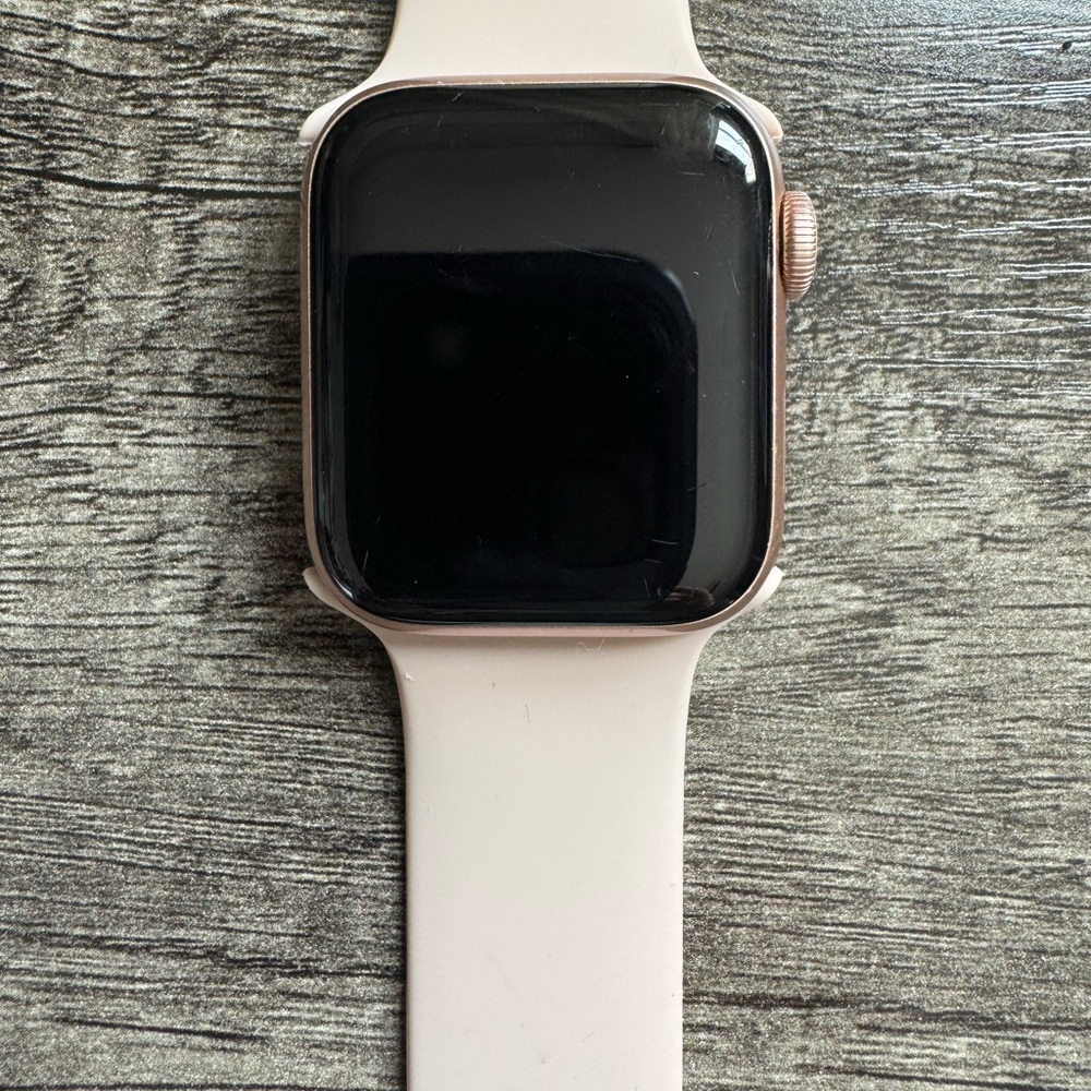 Apple Smartwatch with Black Display and Cream Band